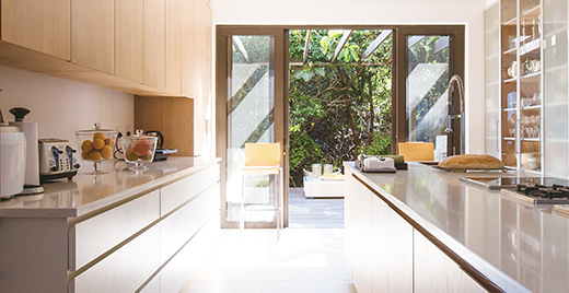 Picture of a kitchen with open patio doors